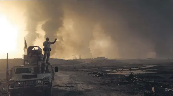  ?? Picture / AP ?? Smoke rises from Isis positions after an airstrike by coalition forces in Mosul.