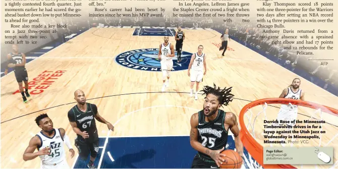  ?? Photo: VCG ?? Derrick Rose of the Minnesota Timberwolv­es drives in for a layup against the Utah Jazz on Wednesday in Minneapoli­s, Minnesota.