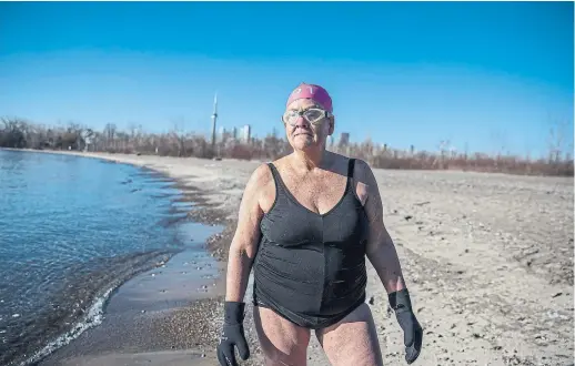  ?? NICK KOZAK PHOTOS FOR THE TORONTO STAR ?? Writer Kathleen McDonnell is a cold-water swimmer. She swims in Lake Ontario year-round, as long as there is open water.