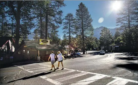  ?? Photograph­s by Gina Ferazzi Los Angeles Times ?? BUSINESSES IN THE mountain community of Idyllwild have shortened their hours, some closing entire days, after heavy rainfall damaged the main roads into town.