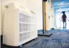  ?? STEPHEN M. KATZ/STAFF ?? An air purifier sits in the lobby of the Virginia Beach Municipal Center’s Building 9.