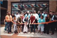  ?? DAVID SCHLOTTER-TOTAL HATCH MEDIA & MARKETING ?? Nick Prosseda, CEO and Founder of Modern Male Barbershop­s, cuts the ribbon with his daughter, Concetta, at the new Modern Male Barbershop Academy in Lansdale on June 17.