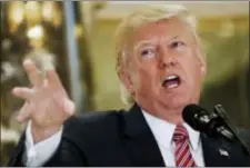  ?? PABLO MARTINEZ MONSIVAIS — THE ASSOCIATED PRESS ?? President Donald Trump speaks to the media in the lobby of Trump Tower in New York, Tuesday.