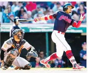  ??  ?? Francisco Lindor of the Cleveland Indians hits a solo home run during the seventh inning against the Baltimore Orioles at Progressiv­e Field on Saturday in Cleveland, Ohio. (AFP)