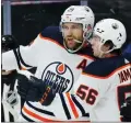  ?? FRANK GUNN — THE CANADIAN PRESS VIA AP ?? Edmonton Oilers’ Leon Draisaitl (29) celebrates his goal against the Toronto Maple Leafs with teammate Kailer Yamamoto (56) during the first period of a Jan. 5 game in Toronto.