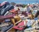  ?? Mark Mulligan / Houston Chronicle ?? Hundreds of holy books from the United Orthodox Synagogues were removed from the flooded building.