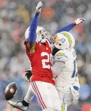  ?? Michael Dwyer/Associated Press ?? New England Patriots cornerback J.C. Jackson, left, breaks up a pass to Los Angeles Chargers wide receiver Keenan Allen during the second half Sunday in Foxborough, Mass.