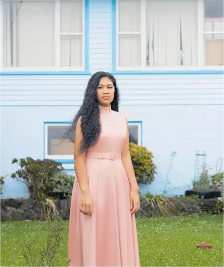  ?? Photos / Derek Henderson for the May 2019 edition of British Vogue. Hair and makeup / Virginia Carde. ?? Auckland University engineerin­g and commerce joint-honours student Lupesina Koro, 19, outside her home in Te Atatu North.