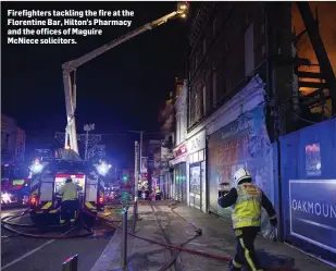  ??  ?? Firefighte­rs tackling the fire at the Florentine Bar, Hilton’s Pharmacy and the offices of Maguire McNiece solicitors.