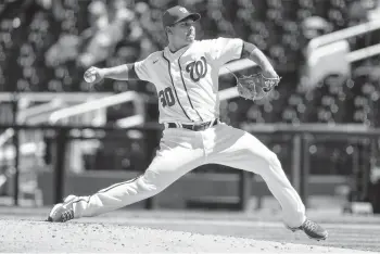  ?? ALEX BRANDON/AP ?? Nationals starting pitcher Paolo Espino throws during the fifth inning against the Arizona Diamondbac­ks at Nationals Park on Sunday.