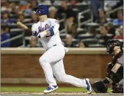  ?? KATHY WILLENS — THE ASSOCIATED PRESS ?? Mets rookie Pete Alonso watches his solo home run during the first inning of Monday’s victory over the Diamondbac­ks. Alonso hit two homers in the game to give him 47this season.