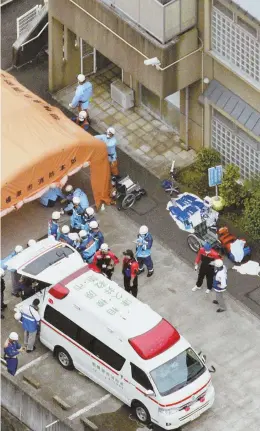  ?? AP PHOTO ?? HORRIFYING SCENE: Ambulance crew and firefighte­rs work outside a facility for the handicappe­d where a number of people were killed and dozens injured in a knife attack today in Japan.