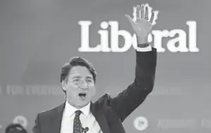  ?? PAUL CHIASSON/THE CANADIAN PRESS VIA AP ?? Prime Minister Justin Trudeau waves following his victory speech Tuesday at Party campaign headquarte­rs in Montreal.