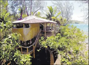  ?? Ben Newton Mandala Island Resort ?? Tonga’s Mandala Island Resort features six seaside tree houses, or fales. Top photo: Sunset on Ofu in the Kingdom of Tonga’s Vava’u island group.