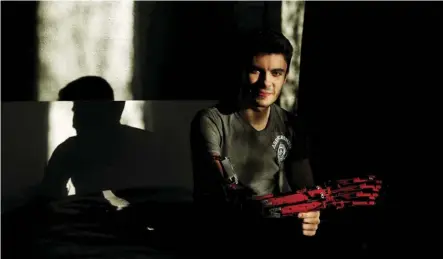  ?? Reuters ?? David Aguilar, 19, displays his Lego arm. He used the plastic bricks to build his first limb at age nine.