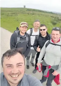  ??  ?? Thomas Poulton, Mike Scott, Ollie Fury, Rick Sherry and Steven Farden are doing the 35-mile Gritstone Trail in a day