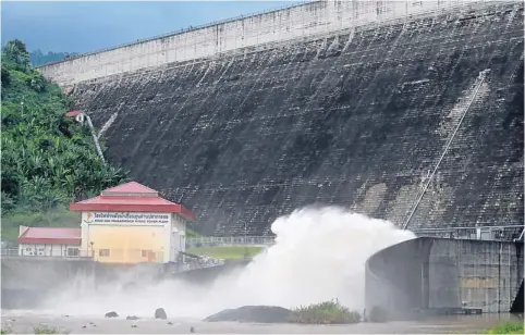  ??  ?? The Khun Dan Prakan Chon dam in Nakhon Nayok province is releasing more water to ease a recent increase in the dam level caused by persistent rainfall.