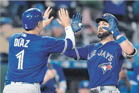  ?? JOHN SLEEZER TNS ?? Kevin Pillar, right, is congratula­ted by Aledmys Diaz after hitting a two-run homer in the eighth inning of Tuesday’s win over the Kansas City Royals.