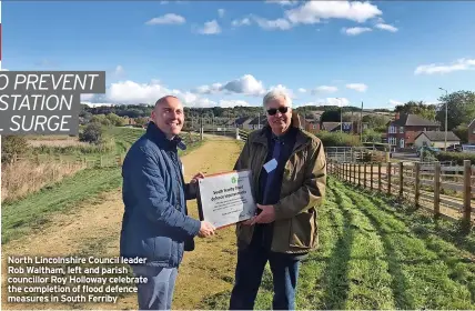  ?? ?? North Lincolnshi­re Council leader Rob Waltham, left and parish councillor Roy Holloway celebrate the completion of flood defence measures in South Ferriby