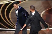  ?? MYUNG CHUN — LOS ANGELES TIMES ?? Will Smith slaps Chris Rock while onstage at the 94th Academy Awards in Los Angeles in March 2022.