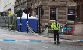  ?? Andrew Milligan/PA ?? A police officer guarding the scene of the attack in Glasgow in June 2020. Photograph: