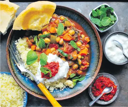  ??  ?? Serve this slower-cooker chickpea stew, rich with vegetables and spice, with pita and couscous or rice.