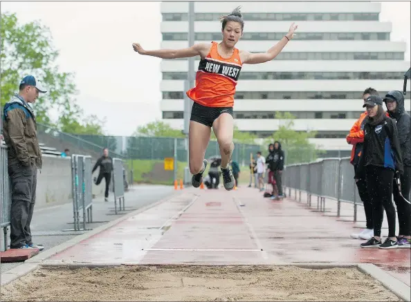  ?? PHOTOS: JASON PAYNE/PNG ?? New Westminste­r student Nina Schultz competes in the long jump at Swangard Stadium in Burnaby this week.