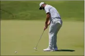  ?? EDUARDO VERDUGO — THE ASSOCIATED PRESS ?? Jon Rahm, of Spain, putts on the first hole during the third round of the Mexico Open at Vidanta in Puerto Vallarta, Mexico, on Saturday.