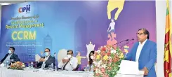  ??  ?? Ken Vijayakuma­r addressing the gathering with dignitarie­s at the head table