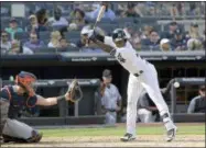  ?? BILL KOSTROUN — THE ASSOCIATED PRESS ?? New York Yankees’ Andrew McCutchen, right, is hit by a pitch as Detroit Tigers catcher James McCann, left, looks on during the eighth inning of a baseball game Sunday at Yankee Stadium in New York.