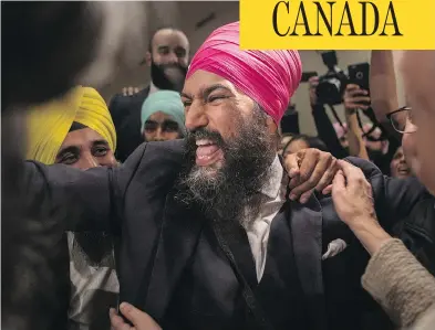  ?? CHRIS YOUNG / THE CANADIAN PRESS ?? Jagmeet Singh celebrates with supporters in Toronto after winning the first ballot in the NDP leadership race, becoming the leader of the federal New Democrats. Singh is only the third NDP leader to have been elected on the first ballot, after Tommy...