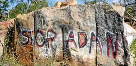  ?? PHOTO: CONTRIBUTE­D ?? PREVIOUS PROTESTS: Graffiti left by anti-Adani protesters in Bowen on the Bruce Hwy about 500m north of the West Euri Creek turn-off.
