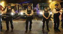  ?? The Associated Press ?? Police officers man a cordon at Finsbury Park in London, where a vehicle struck pedestrian­s early Monday.