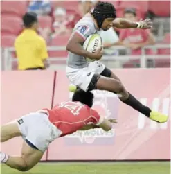  ??  ?? SINGAPORE: In this Saturday, March 4, 2017 file photo South Africa’s Malcolm Adrian Emile Jaer of the Southern Kings leaps over Japan’s Takaaki Nakazuru of the Sunwolves, during their Super Rugby match in Singapore. The South Africa Rugby Union has...