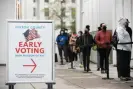  ?? Photograph: Jessica McGowan/Getty Images ?? Voters line up for the first day of early voting for a US Senate special election on 14 December 2020 in Atlanta, Georgia.