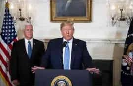  ?? Doug Mills/ The New York Times ?? President Donald Trump, alongside Vice President Mike Pence, delivers a statement Monday about the weekend’s shootings in the nation.