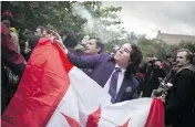  ?? IAN WILLMS / GETTY IMAGES ?? Cannabis users congregate in a Toronto park last week to mark Canada’s legalizati­on of marijuana — a shift that drew negative reactions from some government­s.