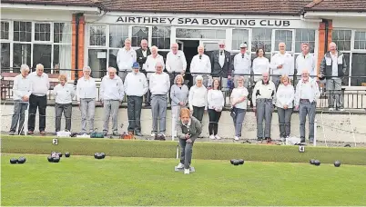  ?? ?? Airthrey Spa Chairman Margaret Forrester gets the season under way watched by members who enjoyed a pre-match lunch before 26 of them took to the green for the first time this year