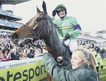  ??  ?? 0 Mon Mome and jockey Liam Treadwell celebrate winning the 2009 John Smith’s Grand National.