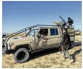  ??  ?? Paramilita­ry Popular Mobilizati­on Forces and local tribal militias participat­e in the military operations of the Iraqi army Seventh Brigade, at the start of the eighth phase of the operation, in Anbar, Iraq, Sunday.