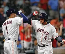  ?? Karen Warren / Houston Chronicle ?? Carlos Correa, left, and George Springer were on pace for outstandin­g seasons before injuries sidelined them in July and made Jose Altuve the only remaining Astros MVP candidate.