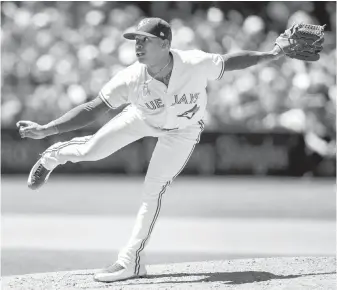  ??  ?? Blue Jays’ Marcus Stroman throws against the Houston Astros in Toronto on Saturday.