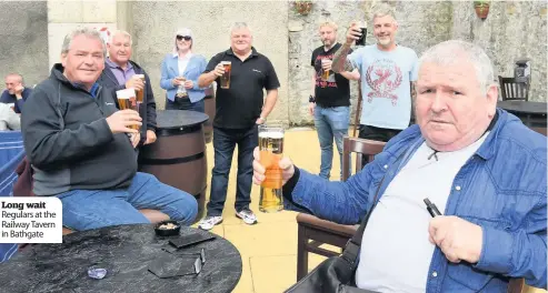  ??  ?? Long wait Regulars at the Railway Tavern in Bathgate