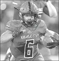  ?? Arkansas Democrat-Gazette/THOMAS METTHE ?? Running back Warren Wand (6) ran for 62 yards and a second-quarter touchdown on nine carries to lead Arkansas State past UAPB 48-3 on Saturday in Jonesboro.