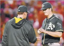  ?? HARRYHOW/ GETTY IMAGES ?? Oakland’s Drew Pomeranz hands the ball off to manager Bob Melvin before leaving the game during the sixth inning.