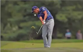  ?? The Associated Press ?? Rickie Fowler hits on the seventh hole during the second round of the Quicken Loans National golf tournament, Friday, in Potomac, Md.