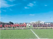  ?? ?? Heath Colts and their Jersey hosts fall silent in memory of Mike Day