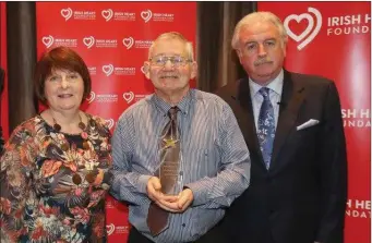  ??  ?? Seamus Dennison with his wife Mary and Marty Whelan at the recent awards ceremony in Dublin. The Bake for Brain Injury Fudraising campagin begins in March with all proceeds going to ABII.