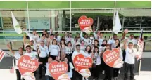 ?? ?? giant team members celebratin­g the launch of the sudah Makan? Csr campaign to help fight hunger ahead of Merdeka day.
