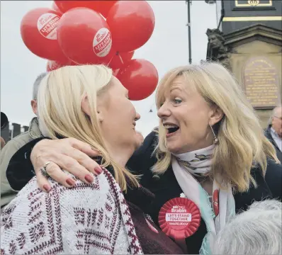  ?? PICTURES: ANNA GOWTHORPE ?? EMOTIONAL DAY: Tracy Brabin, newly elected MP for Batley and Spen, is congratula­ted by supporters in Heckmondwi­ke.